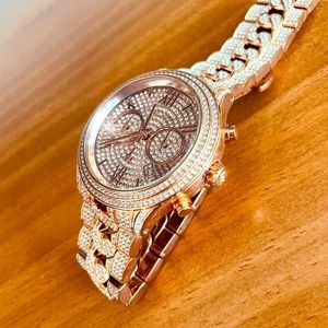 Michael Kors rose gold watch. Blinged out. Only worn a handful of times.